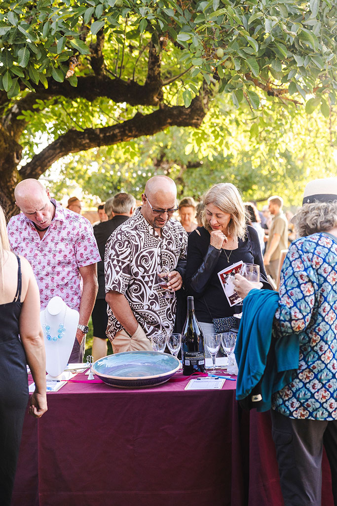 Gala attendees looking at auction items